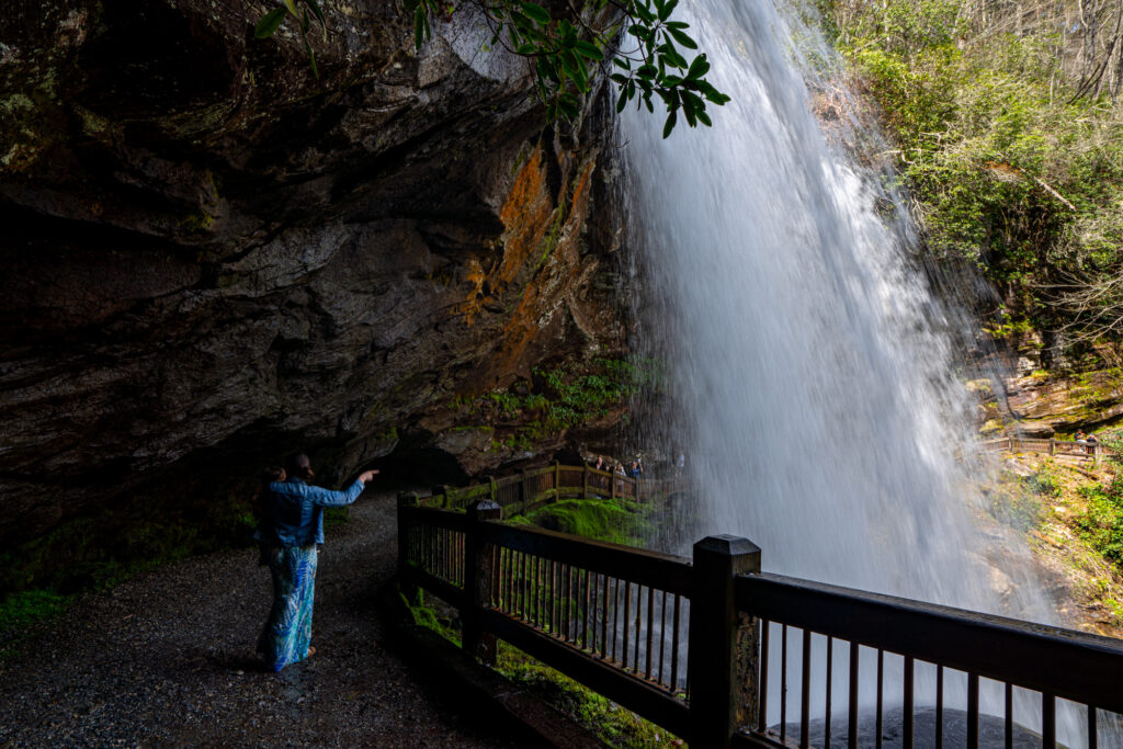 kate storm standing behind dry falls with her toddler