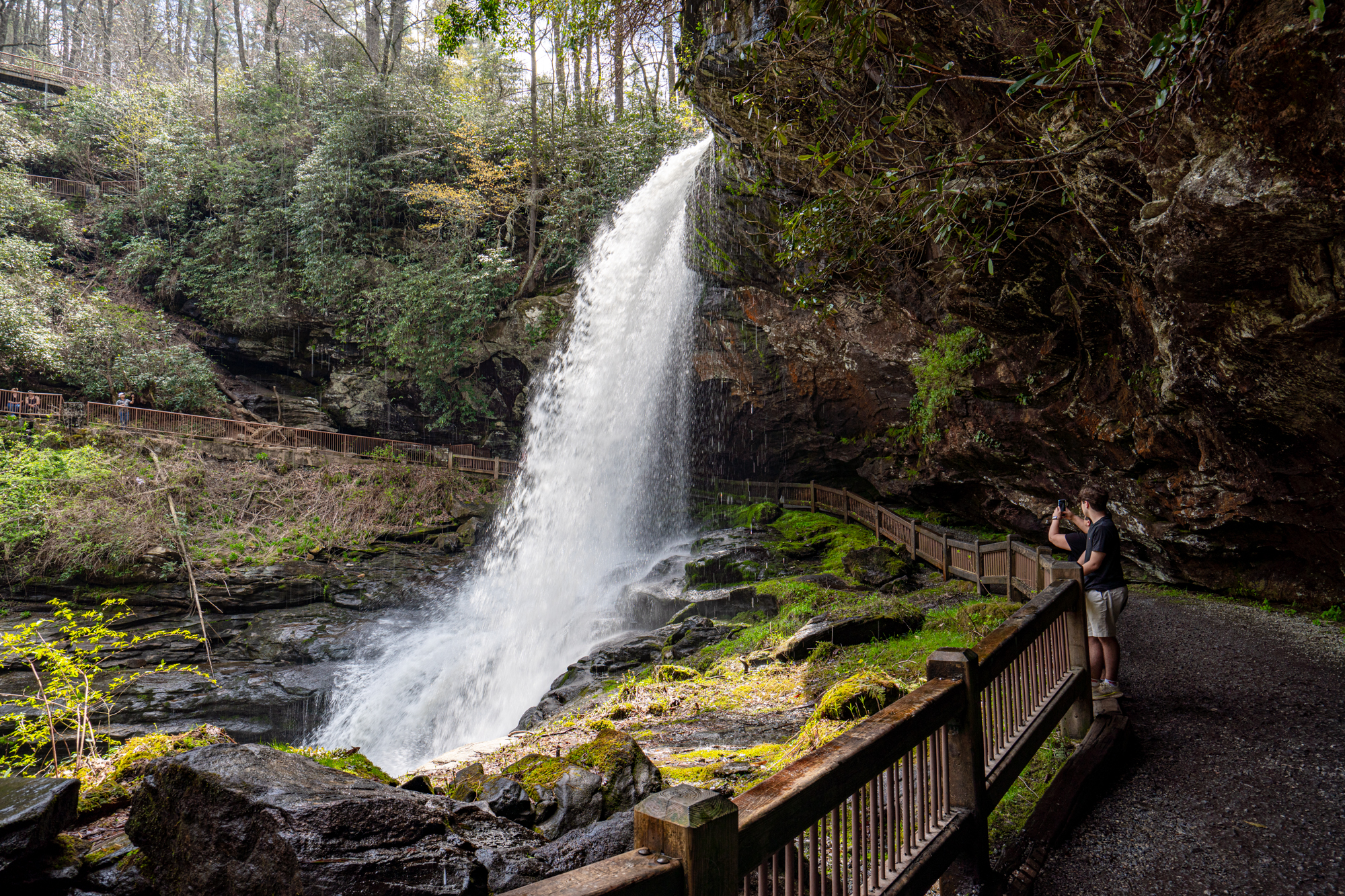 dry falls in highlands north carolina as seen from the trail where you can walk behind the waterfall
